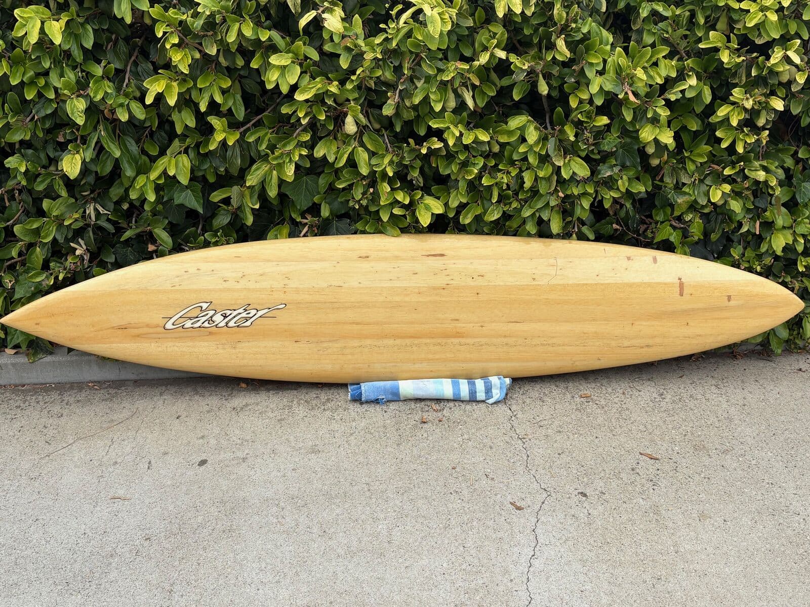 A hand-shaped balsa surfboard auctioned at Duke’s