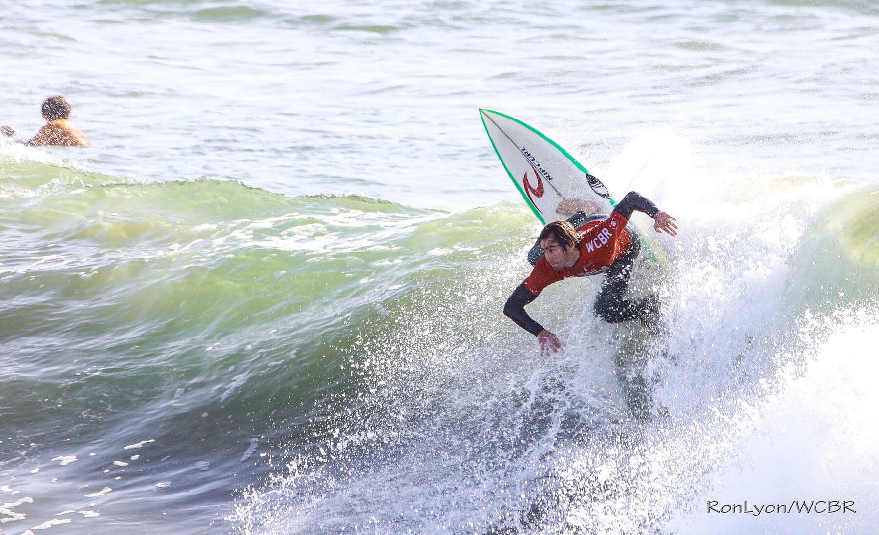 A surfer driving off the bottom