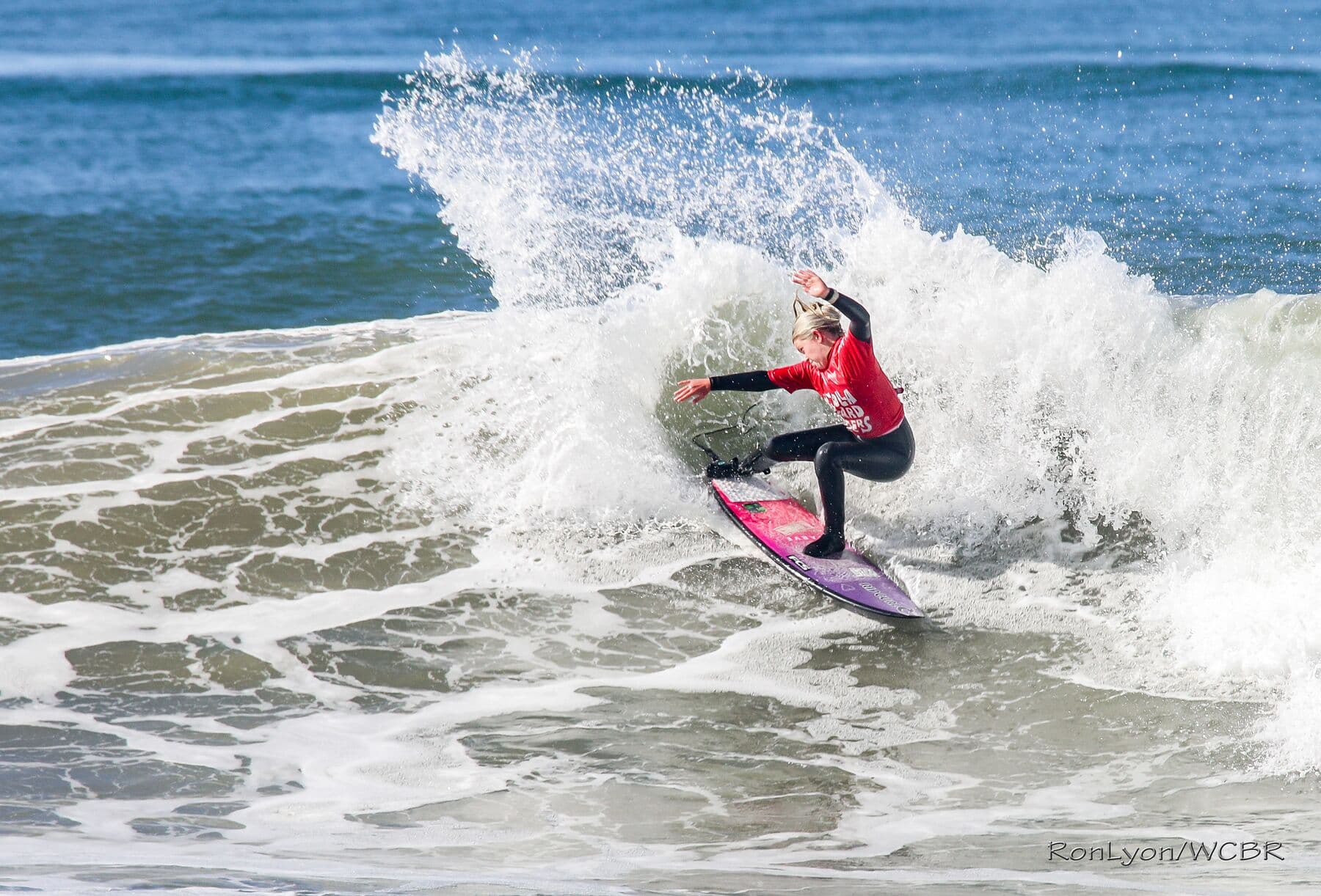 A junior surfer snapping off the top at the Coalition contest