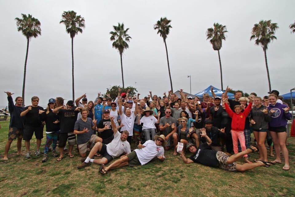 Club volunteers and kids celebrating at Day at the Beach