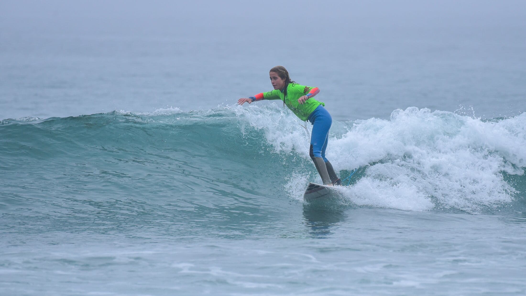 A grom trimming a longboard at La Jolla Shores
