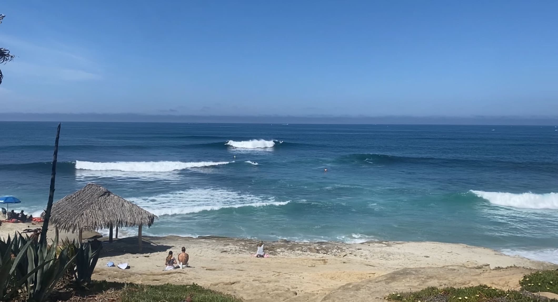 Waves breaking on the Windansea reef with the shack in view